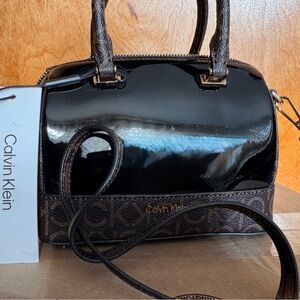 Calvin Klein Ashley Pearlized Mini Top
Zipper Satchel